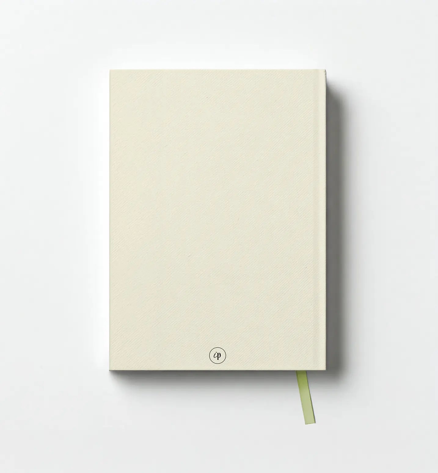 Beige notebook with a green ribbon on a white background