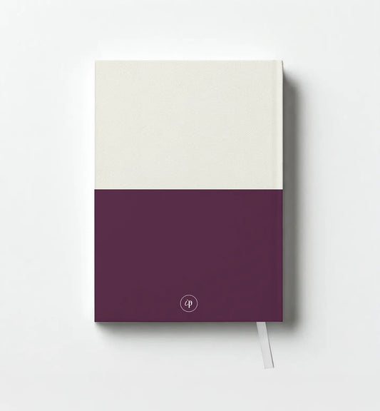 Notebook with a two-tone design, white on top and purple on bottom, on a light gray background.