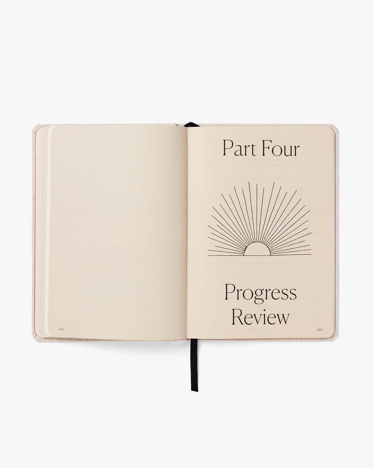 Open notebook with 'Part Four' and 'Progress Review' text on a white background