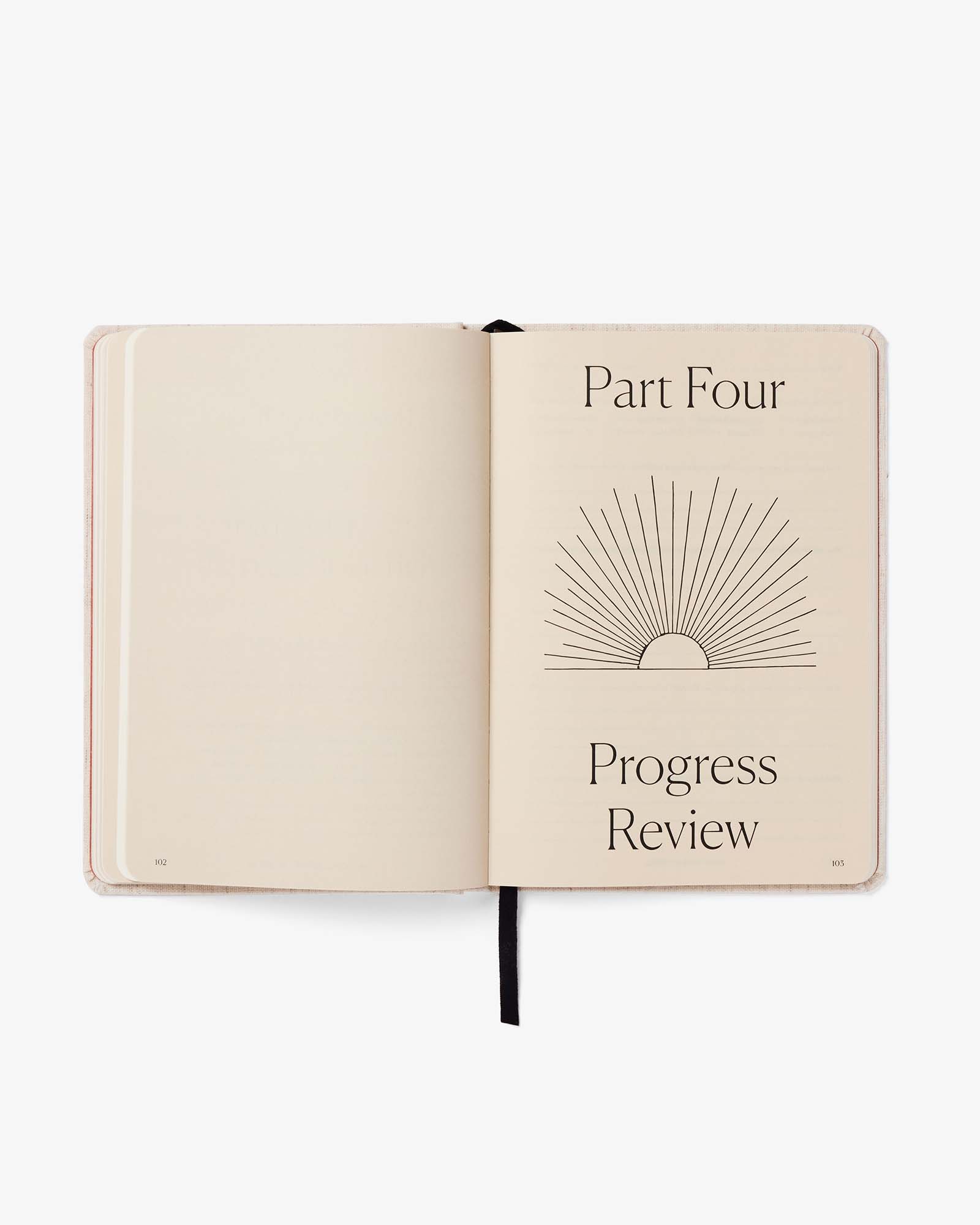 Open notebook with 'Part Four' and 'Progress Review' text on a white background