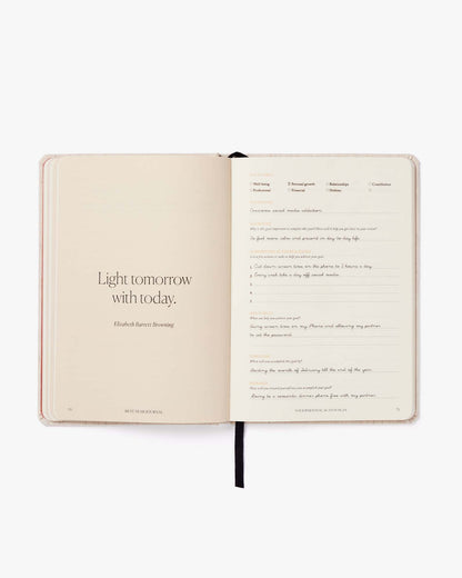 Open notebook with a quote on a white background