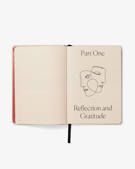 Open notebook with abstract face illustration and text on a white background
