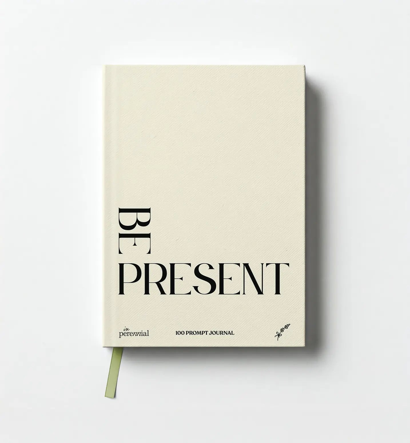 Journal with 'Be Present' text on a white background