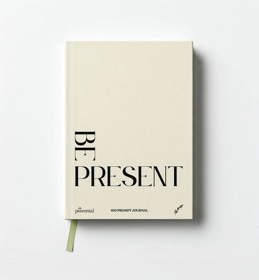 Journal with 'Be Present' text on a white background