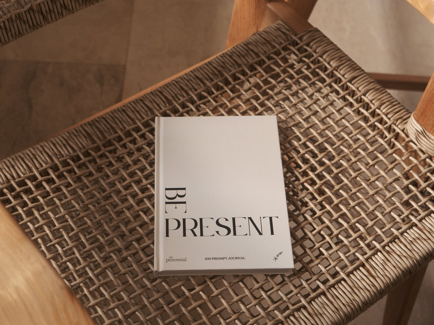 Book titled 'Be Present' on a textured surface