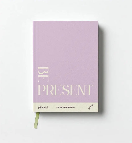 Purple journal with 'Be Present' text on a white background
