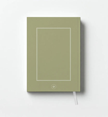 Green notebook with a white line design on a white background