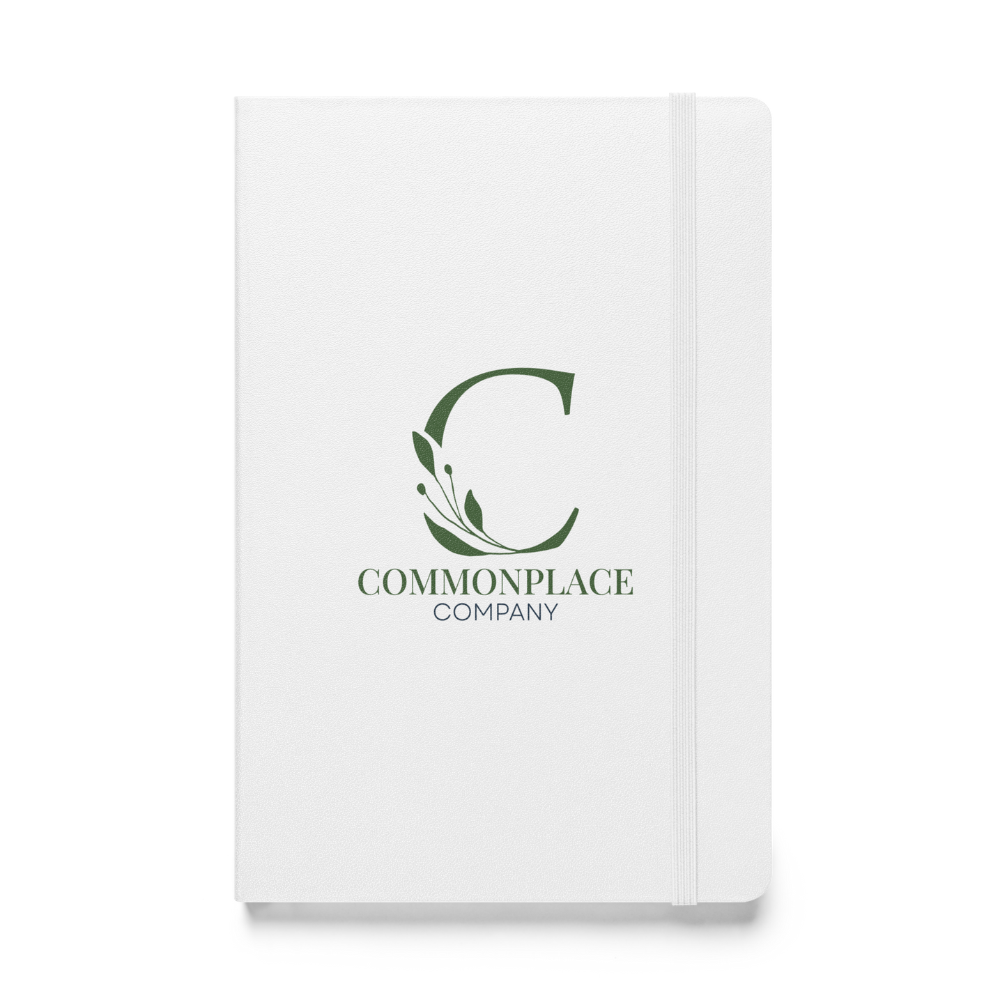 White notebook with The Commonplace Company logo and text on a white background