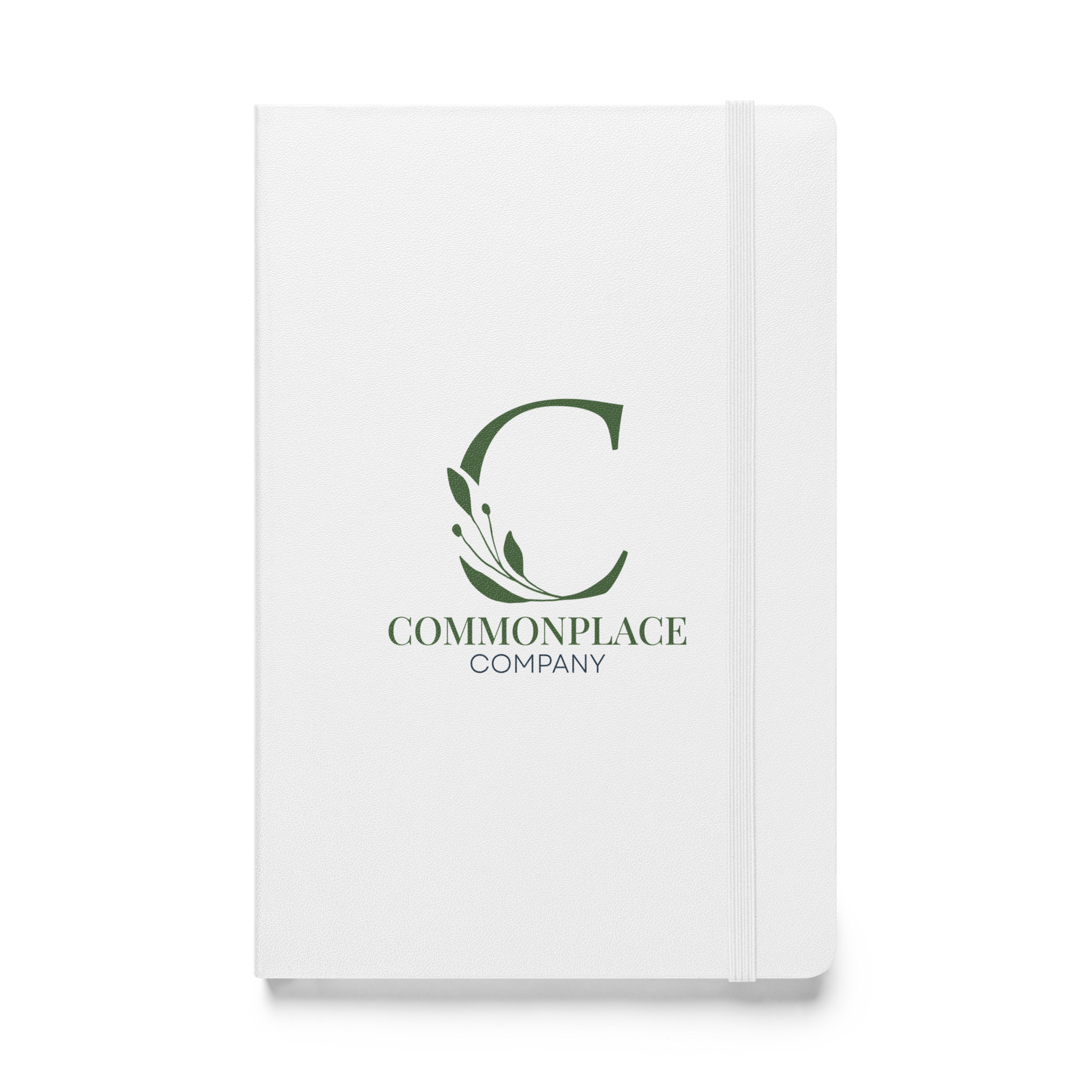 White notebook with The Commonplace Company logo and text on a white background