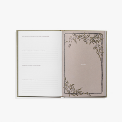 Open book with decorative leaves on a white background