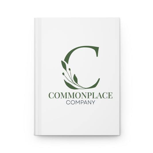 White notebook with The Commonplace Company logo and text on a white background