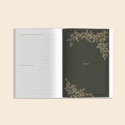 Open notebook with decorative leaf patterns on a beige background