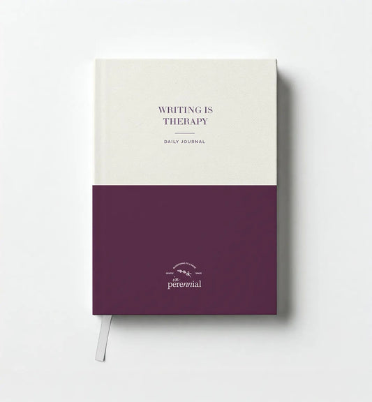 Journal with 'Writing is Therapy' text on a white background